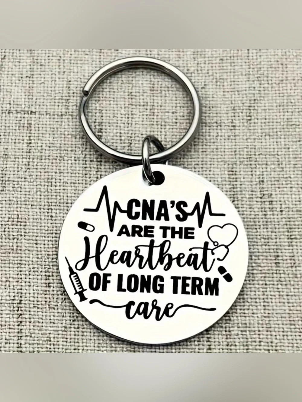 CNA Themed Round Metal Keychain - Silver with Black Text